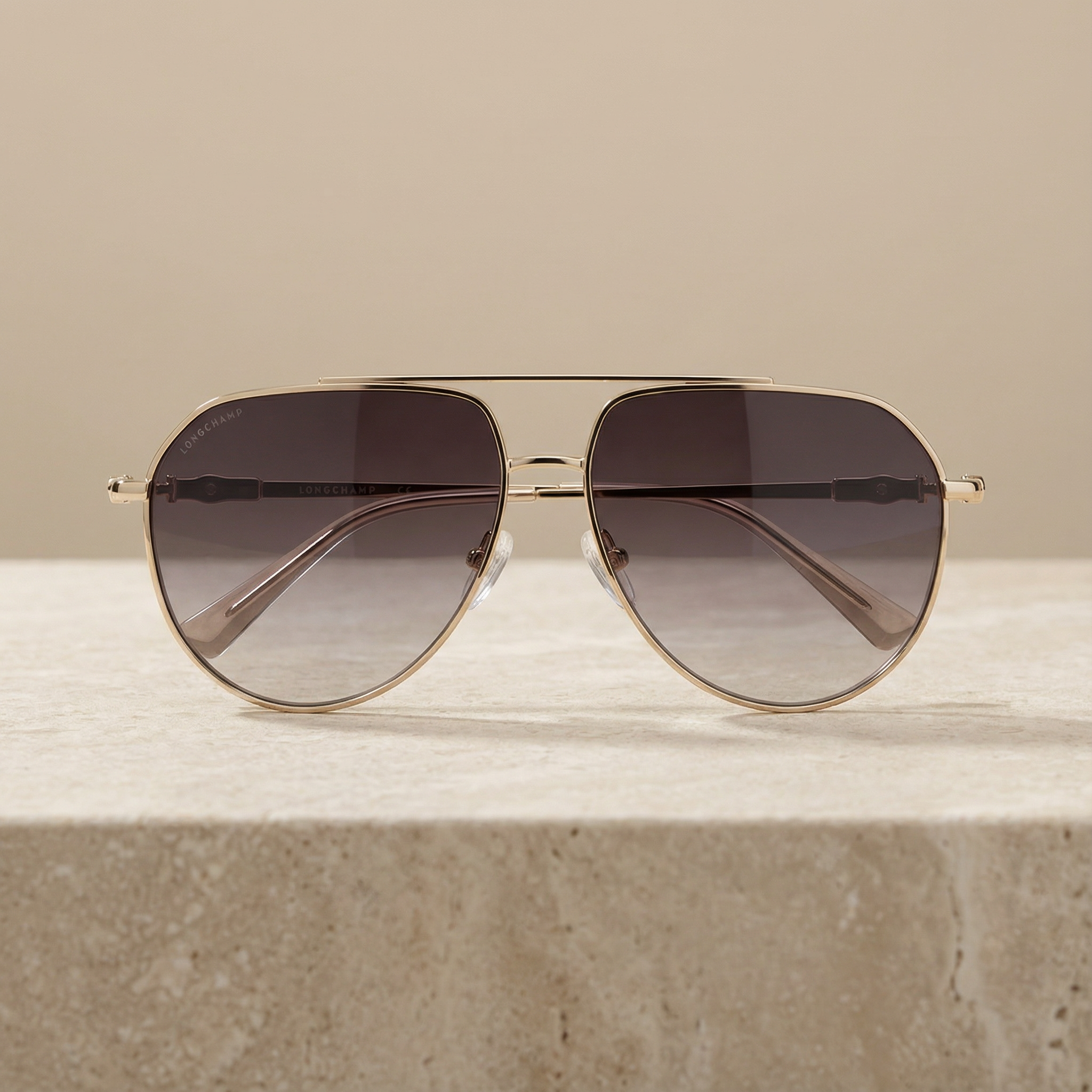 Longchamp Aviator Gold · Elegancia parisina atemporal